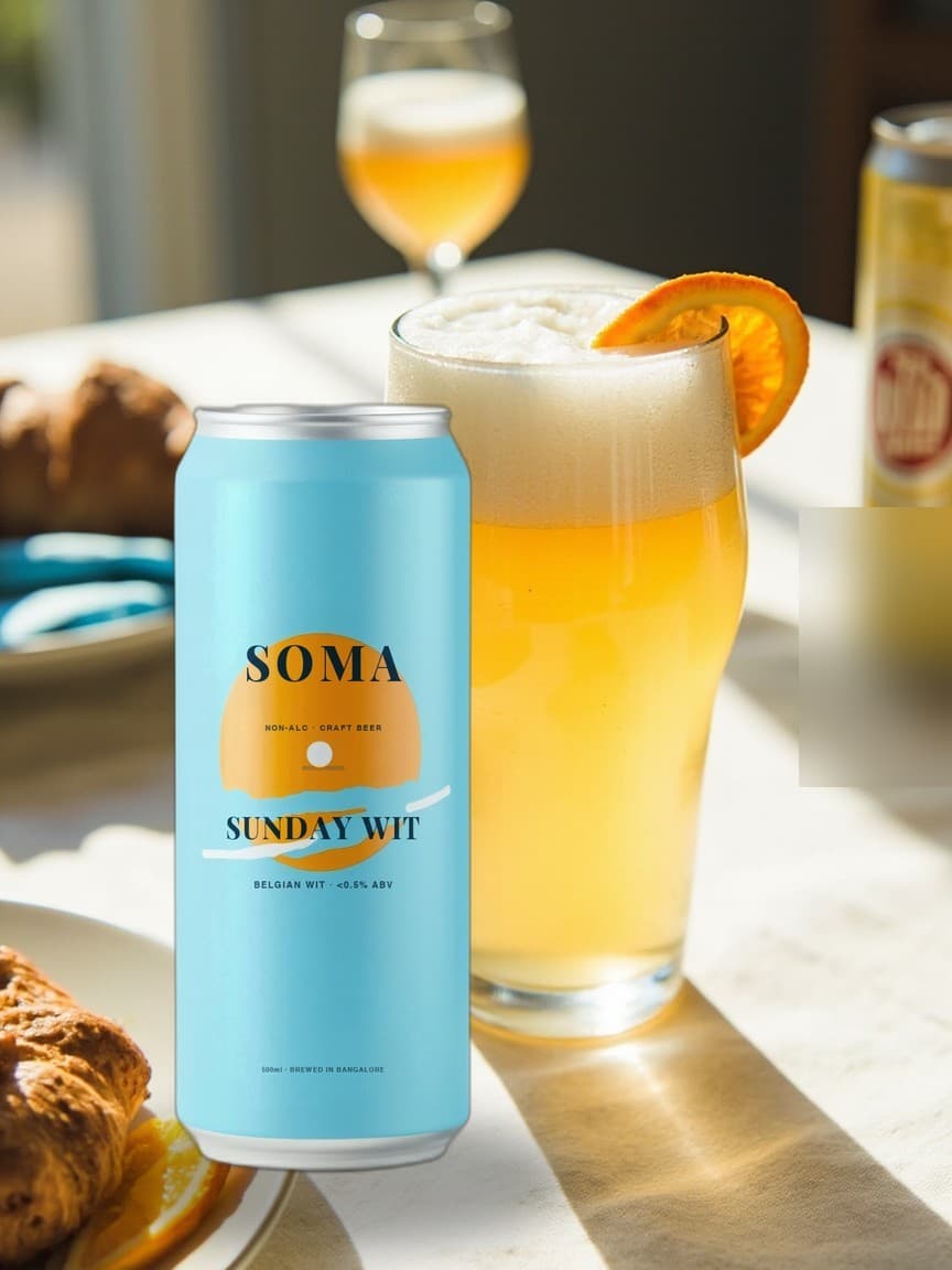 SOMA Belgian Wit can on a sunny brunch table beside a hazy wheat beer