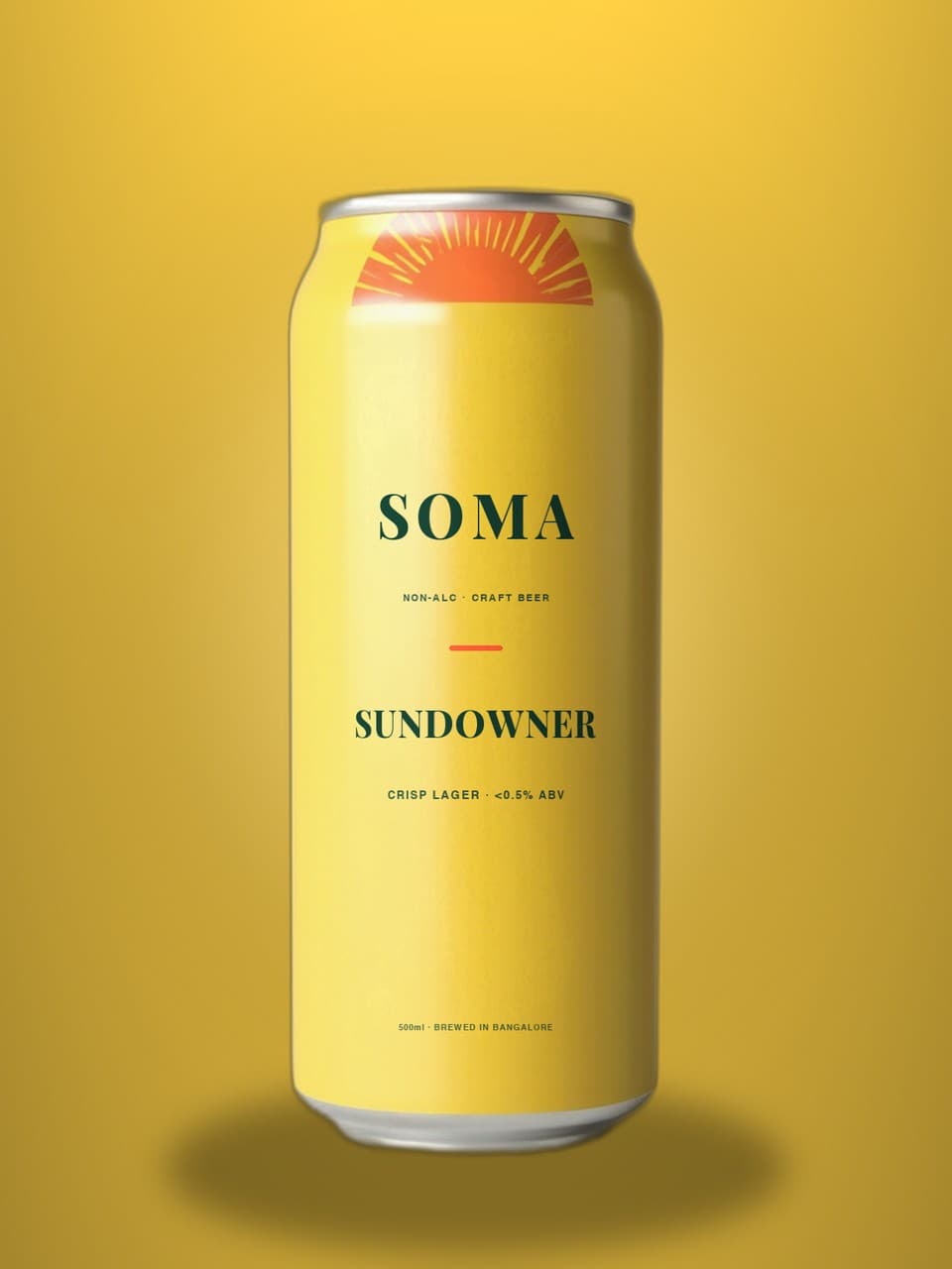SOMA Lager 500ml can on a golden studio backdrop with barley and lemon
